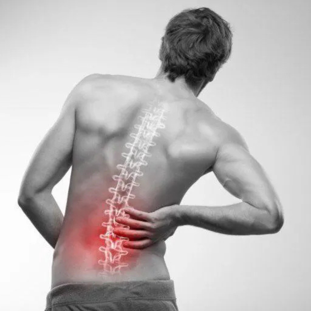 Man with highlighted spine and red area indicating pain on a gray background